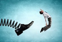 Man gets kicked by oversized shoe on spring