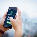 Person using mobile banking app on smartphone