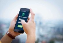 Person using mobile banking app on smartphone