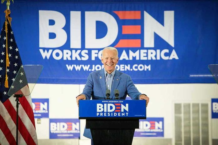 1417577099 Man at podium with Biden campaign signs behind him