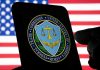 FTC logo on smartphone with American flag background