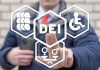 Person pointing at DEI symbols on glass