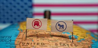 Republican and Democratic flags on USA map background
