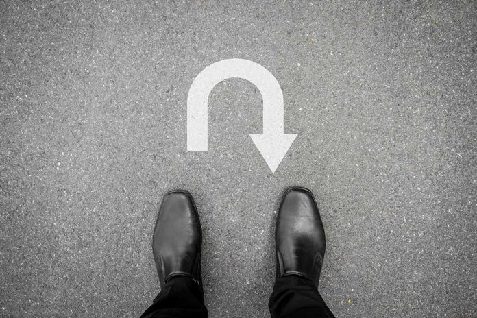 332468855 featured image Feet in black shoes facing U turn road marking