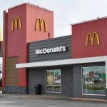 McDonalds restaurant exterior with logo and drive tru sign
