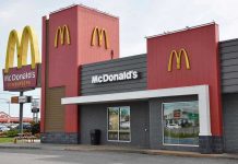 McDonalds restaurant exterior with logo and drive tru sign