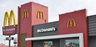 McDonalds restaurant exterior with logo and drive tru sign