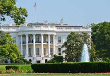 The White House surrounded by gardens and a fountain