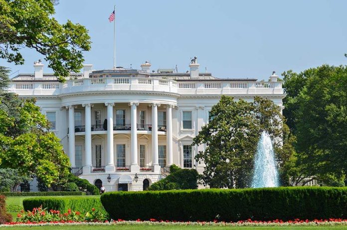 shutterstock_103840784.jpg The White House surrounded by gardens and a fountain