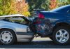 Two cars involved in a rear-end collision on a city street