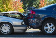 Two cars involved in a rear-end collision on a city street