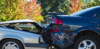 Two cars involved in a rear-end collision on a city street