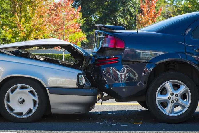 shutterstock_161718998.jpg Two cars involved in a rear-end collision on a city street