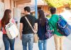 Group of students walking together in a school corridor