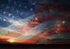 A sunset with an overlay of the American flag and dramatic clouds