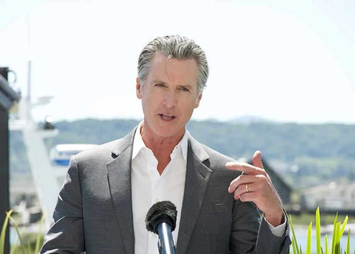 Man speaking with microphone outdoors.