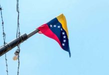 Venezuelan flag flying on a pole