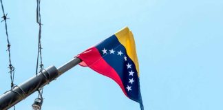 Venezuelan flag flying on a pole