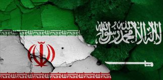 Cracked flags of Iran and Saudi Arabia.