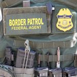 $50K Cartel Bounties—ICE Agents HUNTED Border Patrol vest with gear and communication equipment.