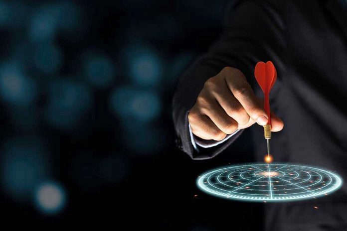 1722840469 Hand aiming dart at digital target.