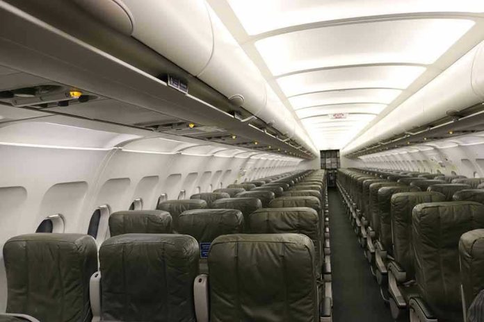 1788580622 Empty airplane cabin with rows of green seats.