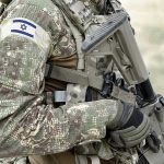 Gaza Tensions EXPLODE: Ceasefire BREACHED! Soldier in camouflage gear with Israeli flag patch.