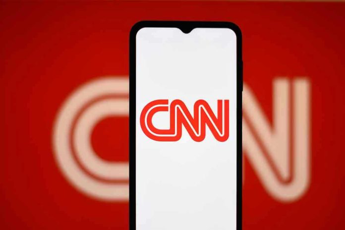 2442890737 CNN logo on a phone screen.