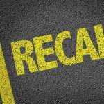 Nationwide Recall CHAOS—Automotive Safety DEFECT! Yellow RECALL text on asphalt background.