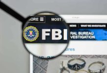 FBI Spies on GOP Senators — Explosive Report FBI website shown through magnifying glass.