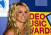 A smiling woman with blonde hair at a music awards event