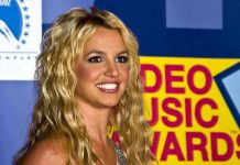 A smiling woman with blonde hair at a music awards event