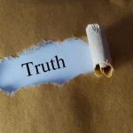 Priest DISCOVERS Truth – Shocking Nazi Scandal Ripped paper reveals word truth underneath brown surface