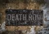 Death Row SCANDAL – Last Minute Intervention! Weathered Death Row sign on aged concrete wall