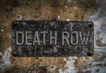 Death Row Showdown: Inmate REFUSES Execution! Weathered Death Row sign on aged concrete wall