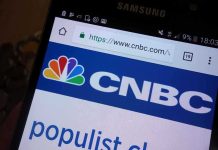 Trump SLAMS TV Host- Calls Him “Deranged Lunatic” Close-up of a smartphone displaying the CNBC website