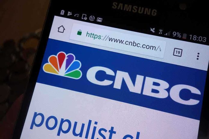 Close-up of a smartphone displaying the CNBC website