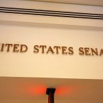 Senator COLLAPSES – Emergency Health Scare Sign displaying United States Senate in a government building