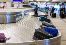 Knife-Wielding Intruder Sparks Airport Chaos Luggage on a conveyor belt at an airport baggage claim area
