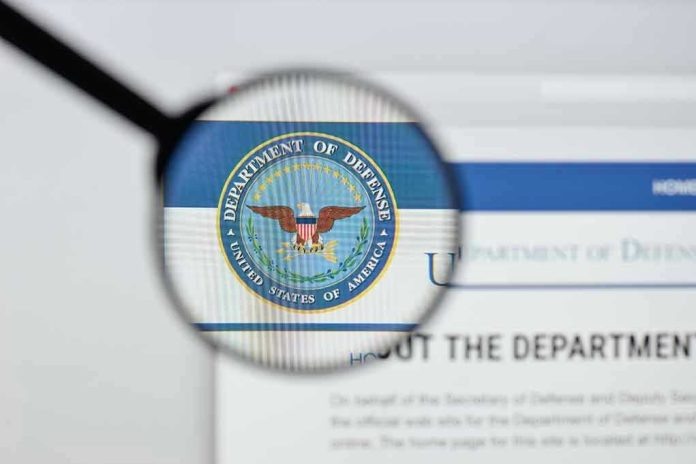 Magnifying glass over Department of Defense logo.