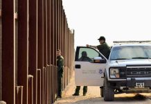 Trump’s Deportation Team DIVIDED – What’s Happening? Border patrol agents near a tall metal fence.