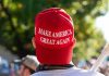 MASSIVE Betrayal – Trump Support Base Turn Person wearing a red Make America Great Again hat.