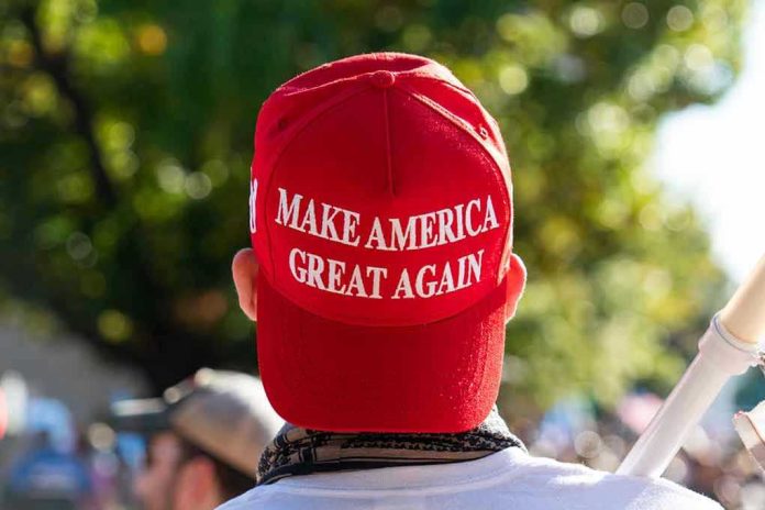 1850438311 Person wearing a red Make America Great Again hat.