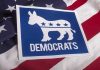 Disgraced Dem Launches Comeback – Announces Governor Bid Democrats logo on American flag background