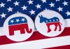 Candidate’s LAst-Minute Party Flip Shocks Democrat Donors Republican elephant and Democrat donkey on American flag.