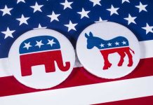 Candidate’s LAst-Minute Party Flip Shocks Democrat Donors Republican elephant and Democrat donkey on American flag.
