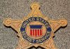 Vance Bodyguard BUSTED in Massive Scheme Golden badge of the United States Secret Service displayed on a surface