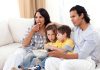 Netflix Kids’ Shows Bombshell: Nearly Half Push LGBTQ Themes A family of four enjoying a movie night on the couch with snacks