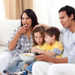 Netflix Kids’ Shows Bombshell: Nearly Half Push LGBTQ Themes A family of four enjoying a movie night on the couch with snacks