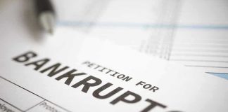 Petition for bankruptcy document with pen.
